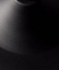 Close-up of matte black finish on Black Finish Pendant Light With Clear Glass Shade 1 Light Fixture Includes 60W Bulb Easy Connect Installation 11 Inch Wide By 18 Inch High Sleek Modern Design For Kitchen Island Dining Area Or Living Space.