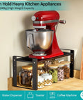 Stack Your Pantry Goods Without A Sweat, 2 Pack Expandable Cabinet Organizer Shelves, Adjustable Space Saving Heavy Duty Metal Storage Rack For Kitchen Cupboards And Under Sink, Sleek Black Finish with a red mixer on top.