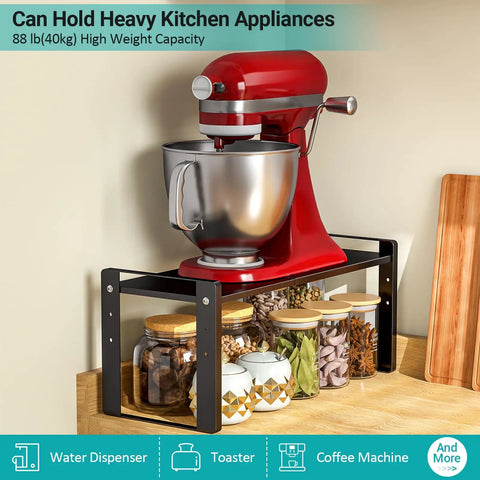 Stack Your Pantry Goods Without A Sweat, 2 Pack Expandable Cabinet Organizer Shelves, Adjustable Space Saving Heavy Duty Metal Storage Rack For Kitchen Cupboards And Under Sink, Sleek Black Finish with a red mixer on top.