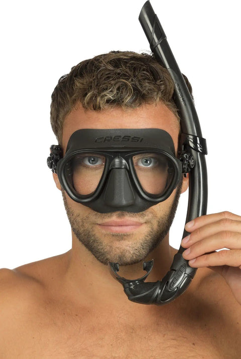 Person wearing the Calibro And Corsica Dive Mask Set In Blue, Pro Grade Italian Craft For Freediving And Scuba with snorkel attachment.