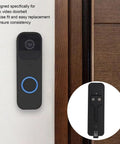 Sturdy Black Back Plate Mount Accessory For Video Doorbell Quick Install And Easy Repair next to a wooden door