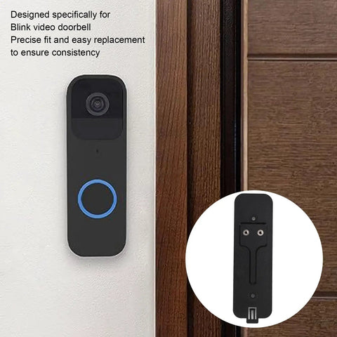 Sturdy Black Back Plate Mount Accessory For Video Doorbell Quick Install And Easy Repair next to a wooden door