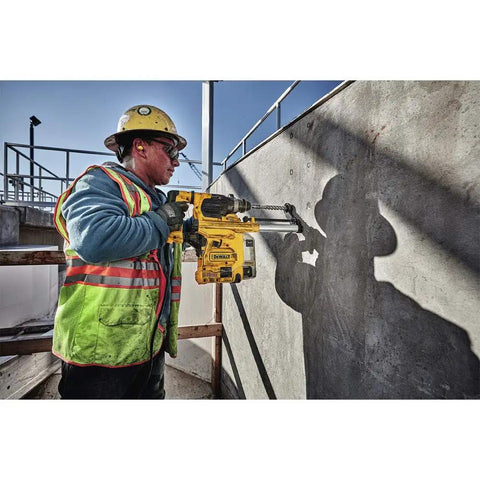 Construction worker using Onboard Dust Extractor for 1-1/8-Inch SDS Plus Rotary Hammers With Clear Dust Box and Replaceable Nozzle