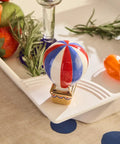 Red White Balloon Hand Painted Ceramic Holiday Decor Spring Mini on table with fruits and herbs