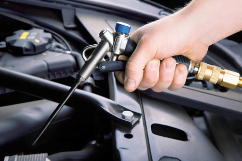 Two-Way Air Blow Gun With Adjustable Air Flow And Extended 4.5 Inch Nozzle for tight spots, showing hand grip on tool.