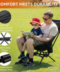Father and child sitting on Armless Rocking Camping Chair With Spring Action Tech, Portable Folding Outdoor Rocker For Adults.