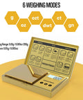 Pocket Scale 200G Capacity With 0.01G Precision, gold titanium plating, LCD backlit display open, showing 6 weighing modes