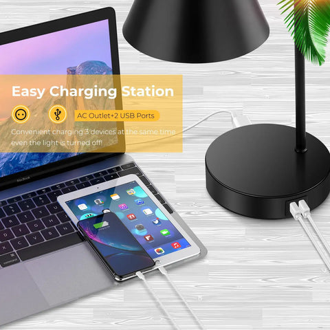 Must Have Dimmable Desk Lamp With 2 USB Ports And AC Outlet next to charging laptop and tablet on wooden desk.