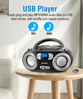 Portable CD Player Boombox with FM Radio Bluetooth USB Port and Aux Input for Home or On The Go on a table with a USB drive