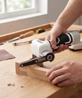 NoSweat 12V Cordless Detail Belt Sander being used on wood for finishing, showcasing the brushless motor and adjustable flex head.