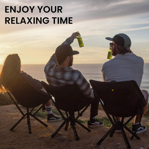 Three people sitting on Ultra Lightweight Backpack Chair With 5 Second Folding, Grab And Go Packable Camp Chair at sunset