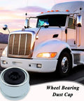 Truck driving at sunset with focus on a wheel bearing dust cap
