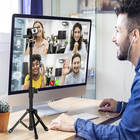 Extendable Desk Webcam Tripod Stand For Cameras And More used for a video conference on a desk.