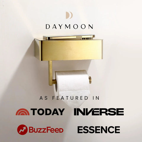 Gold toilet paper holder with shelf, wall-mounted, featured in media outlets, sleek design for modern bathrooms