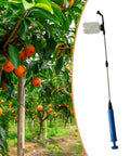 Telescopic 93cm Fruit Pollinator Sprayer With Metal Rod Lightweight And Grab And Go Pollination Tool beside orange trees