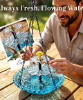 Solar Powered Hanging Bird Bath Fountain For Outdoor Gardens And Patios, Eco Friendly Water Cascade With Flowing Water shown on a patio table.