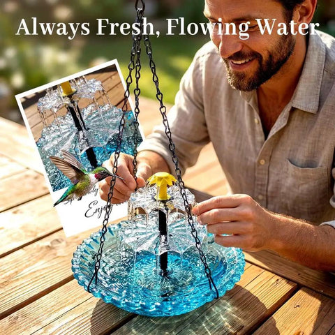 Solar Powered Hanging Bird Bath Fountain For Outdoor Gardens And Patios, Eco Friendly Water Cascade With Flowing Water shown on a patio table.