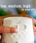 Hand adjusting settings on Plug In Scent Booster Starter Kit With Ocean Refills, Black Oil Diffuser Air Freshener