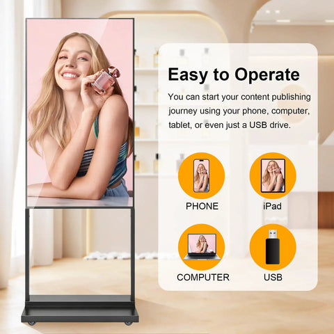 Crisp 55 Inch 4K Floor Standing Digital Signage Screen With Smooth Rolling Casters And Bright High Resolution Display in use with phone and tablet.