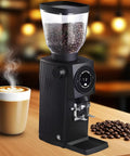 Rock Solid Commercial Espresso Grinder With 83 Mm Steel Flat Burrs And Compatible Ssp Blades Built Different For Cafes And Tea Rooms Featuring A Sleek Lcd Touchscreen And Real Time Controls For Flawless Daily Brewing, displaying coffee beans in hopper.