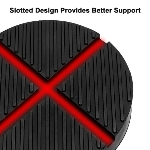 Round black rubber floor jack pad with grooved surface, close-up view.