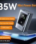 Rugged 35 Watt Fast Charging Power Battery Case With Type C And Usb Ports For Phones Laptops Hella Compact Build on a table.