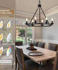 Solid Black Farmhouse Chandelier Fire Wagon Wheel Pendant Light Top Shelf Six Light Ceiling Fixture Top Tier Rustic Hanging Lamp above dining table.