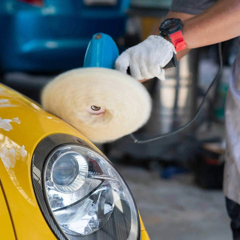 Person using Eight Inch 100 Percent Natural Wool Buffing Pads Set Pro Grade With Hook And Loop Backing on yellow car