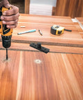 Carpenter installing Stainless Steel Hidden Pivot Door Hinges With 360 Degree Rotation Concealed Center Shaft Hardware on wooden panel