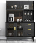 Modern kitchen cabinet with black finish, showcasing glassware, mugs, and a coffee maker. Gold pull handles for wardrobe cabinets.