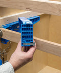 Person using Drawer Slide Jig And Concealed Hinge Jig Kit For Cabinets And Desks, No Fuss Install Of Cabinet Slides on a cabinet.