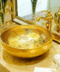 USZWBY Bathroom Vessel Sink, Countertop Basin Round Sink Bathroom Sink Hotel Art Sink Bathroom Sink in gold on marble countertop.