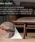 Furniture Levelers Kit 16 Pack 2 Inch Brown Rubber Shims inserted under table leg on wooden floor