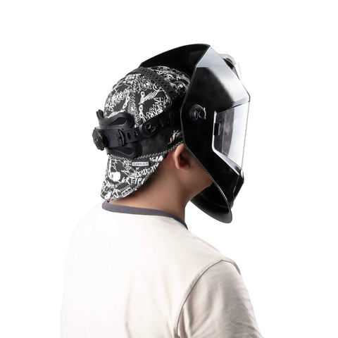 Back view of Reversible Welding Cap With Elastic Band, Durable Protective Welders Hat For Heat Resistance, Sweat Wicking And Dust Blocking, Black And White Color, Comfy Fit For Long Welding Sessions, Built To Last worn under a helmet