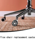Heavy Duty Office Chair Caster Wheels 2.5 Inch Polyurethane Swivel Rollers close-up on carpet surface.