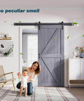 Gray Wood Barn Door Slab 36 Inch By 84 Inch With 6.6 Ft Barn Door Hardware Track Kit Included in modern home setting