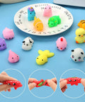 30 Pack Totally Rad Squishy Toys Mini Kawaii Mochi Squeeze Buddies with colorful animal designs on a plate.