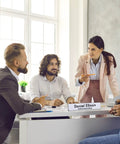 Office meeting with table displaying 20 Pack Acrylic Desk Name Plates 2 By 10 Inch Clear Plastic Name Tent Holders.