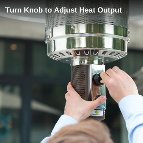 Close-up of adjusting a stainless knob on the Beast 50,000 BTU Outdoor Patio Heater With Round Table Design, for precise heat control.