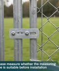 Built Like A Tank Adjustable Galvanized Gate Latch Stopper for Chain Link Fences installed on metal posts.