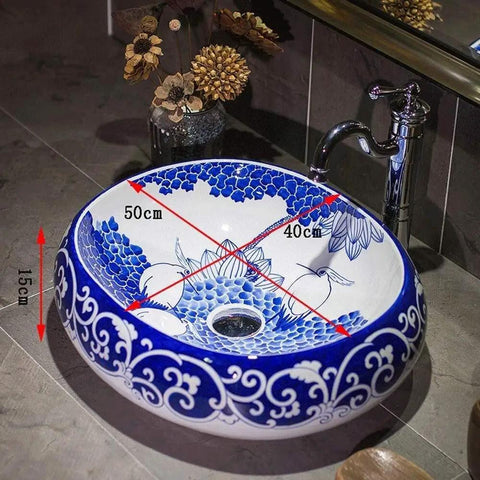 Slick Oval Vessel Sink For Bathroom Vanity Top Notch Premium Porcelain Countertop Wash Basin featuring hand painted lotus bird motif, 50cm x 40cm, high gloss finish.