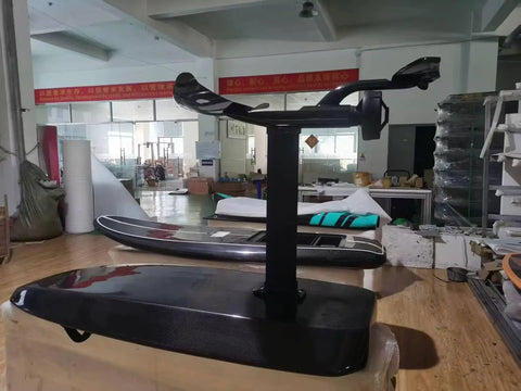 High Power Electric Hydrofoil Surfboard with Full Carbon Fiber Build and 8000W motor in workshop, side view
