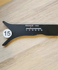 Slick Sliding Radius Gauge With A Solid Ergonomic Grip And Dang Accurate Engraved Scale For Quick Drafting And Hardwood Joinery Projects Plus Rustproof Finish For Daily Shop Grind on wooden surface