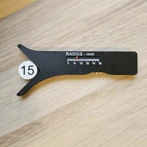 Slick Sliding Radius Gauge With A Solid Ergonomic Grip And Dang Accurate Engraved Scale For Quick Drafting And Hardwood Joinery Projects Plus Rustproof Finish For Daily Shop Grind on wooden surface