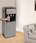 Bottom Loading Water Dispenser With Three Water Modes Hot Cold And Room Temperature in a home setting beside a couch