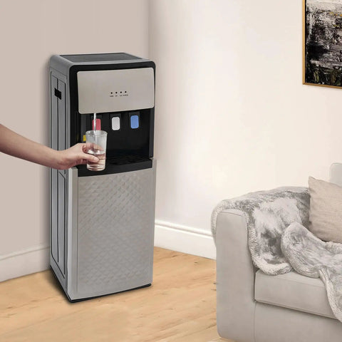 Bottom Loading Water Dispenser With Three Water Modes Hot Cold And Room Temperature in a home setting beside a couch