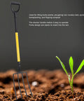 Long Handle Garden Spading Fork With Y Grip 4 Tine Metal Digging Fork For Gardening And Composting in soil with plant.
