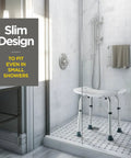 Shower Chair With Back Scrubber And Sponge, Tool Free Setup, Adjustable Height 13 To 19 Inches in a small shower