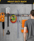 Garage Wall Mount Tool Organizer With Heavy Duty Hooks 48 Inch Steel Yard And Garden Tool Holder Holds Up To 450 Lbs For All Your Gear Rake Broom Mop Snowboard And More Keeps Your Workshop Shed And Garage Clutter Free installed in garage