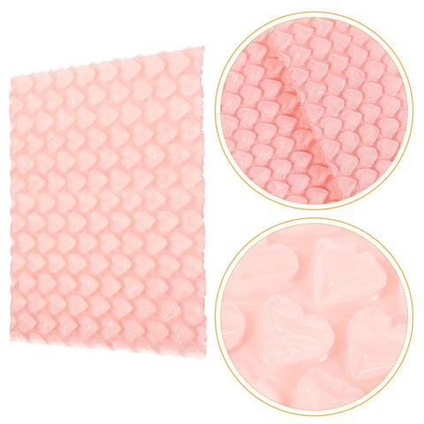Close-up of pink heart shaped bubble wrap, part of Pink Heart Shaped Bubble Mailers Pack 50 Lightweight Shockproof Envelopes For Jewelry and Collectibles.